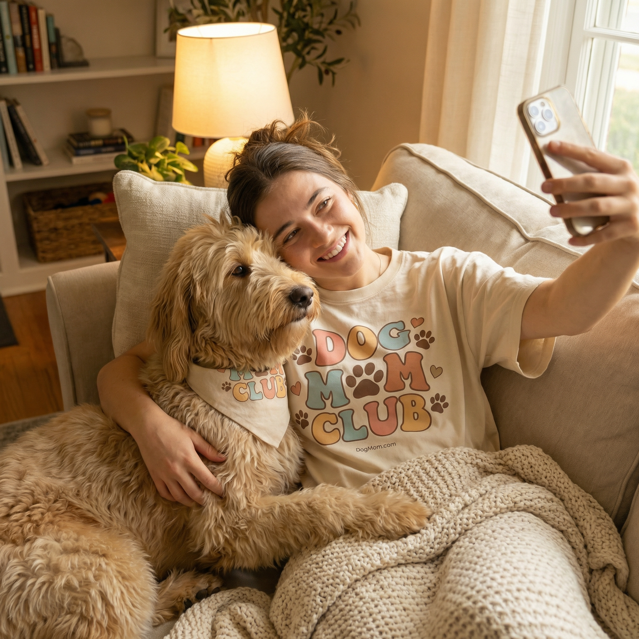 Dog mom couch selfie with goldendoodle wearing Dog Mom Club tee
